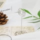 thumbnail image 2 of Paquete de 12 soportes con clip para tarjetas de presentación y notas, soportes para números de mesa en forma de círculo plateado, 2 of 8