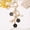 black, variant on Japanese-style handmade cherry blossom keychain with oil-drop design, perfect for handbags.