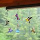 thumbnail image 1 of Alimentador de colibrí pintado con forma de campana de viento, colgante para exteriores, refractor de luz solar, 1 of 5