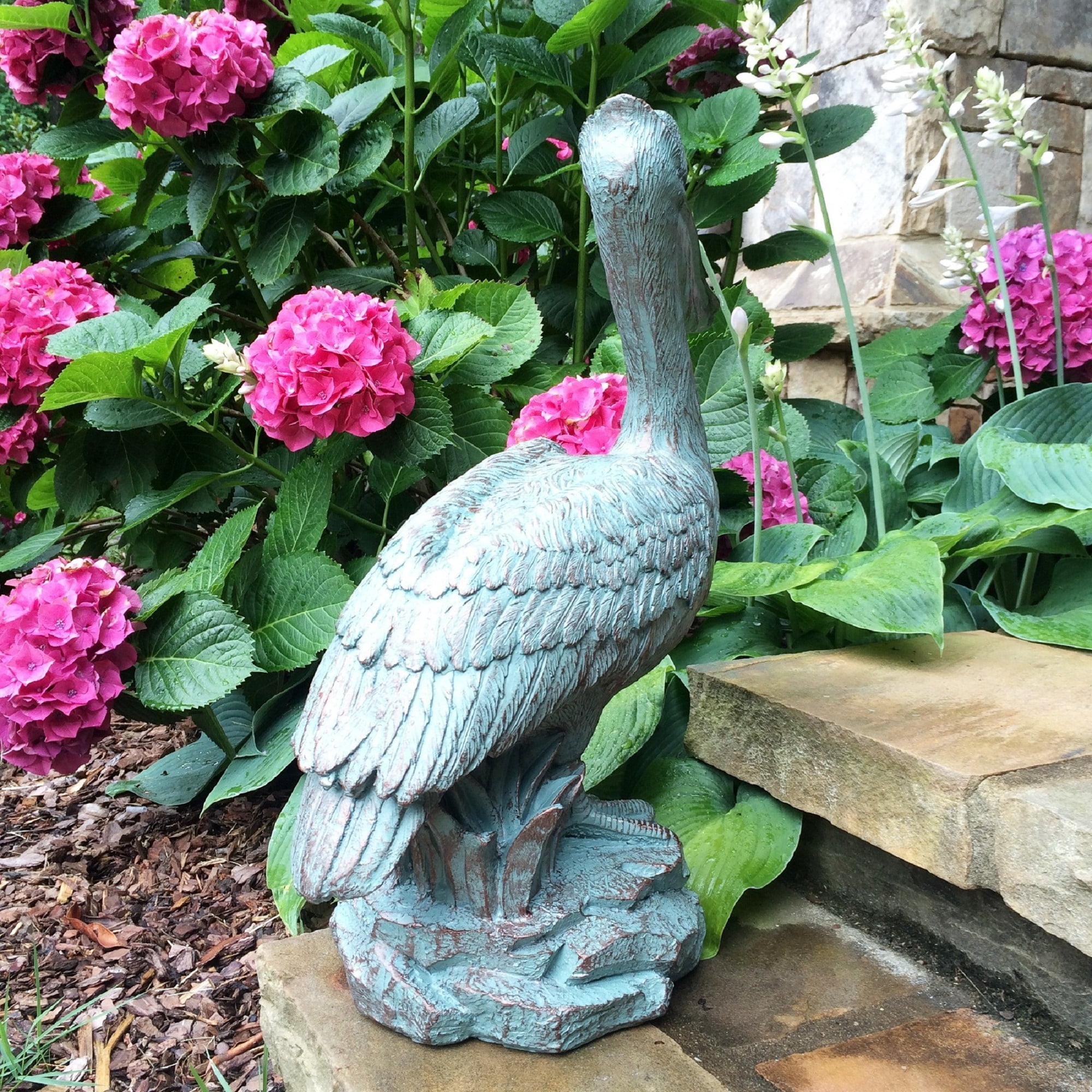 Homestyles 20 in. Bronze Patina Pelican on Coastal Rock Beach Statue