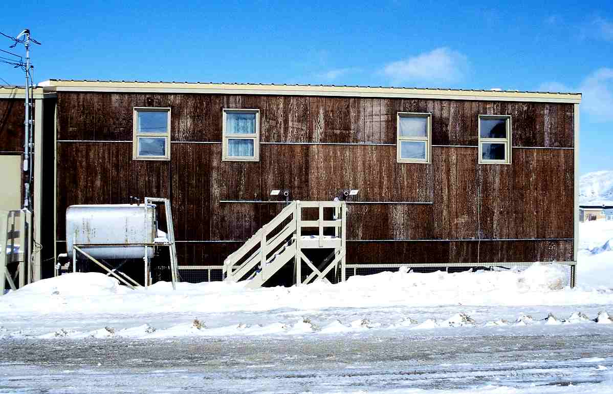 Deutsch House in Cape Dorset, Nunavut, Canada / Oil tank and water
