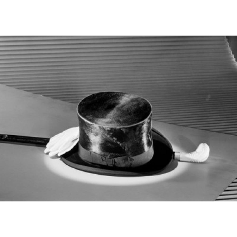 Studio shot of top hat walking cane and white gloves Poster Print (24 x 36)