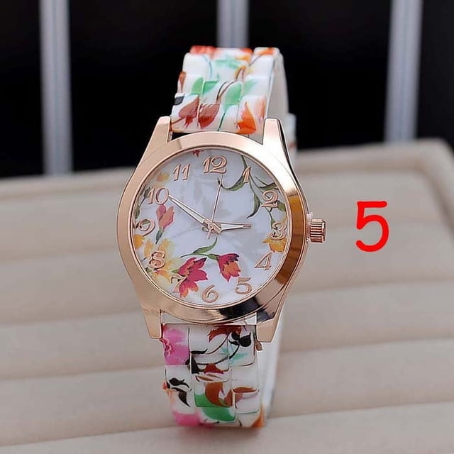 Women Flower Print Silicon Band Arabic Numerals Dial Quartz Wrist Watch featuring a retro floral design on the dial and band. The watch has a rose gold-tone case, Arabic numeral markers, and an adjustable pin buckle fastening. Suitable as a stylish accessory or a thoughtful gift.