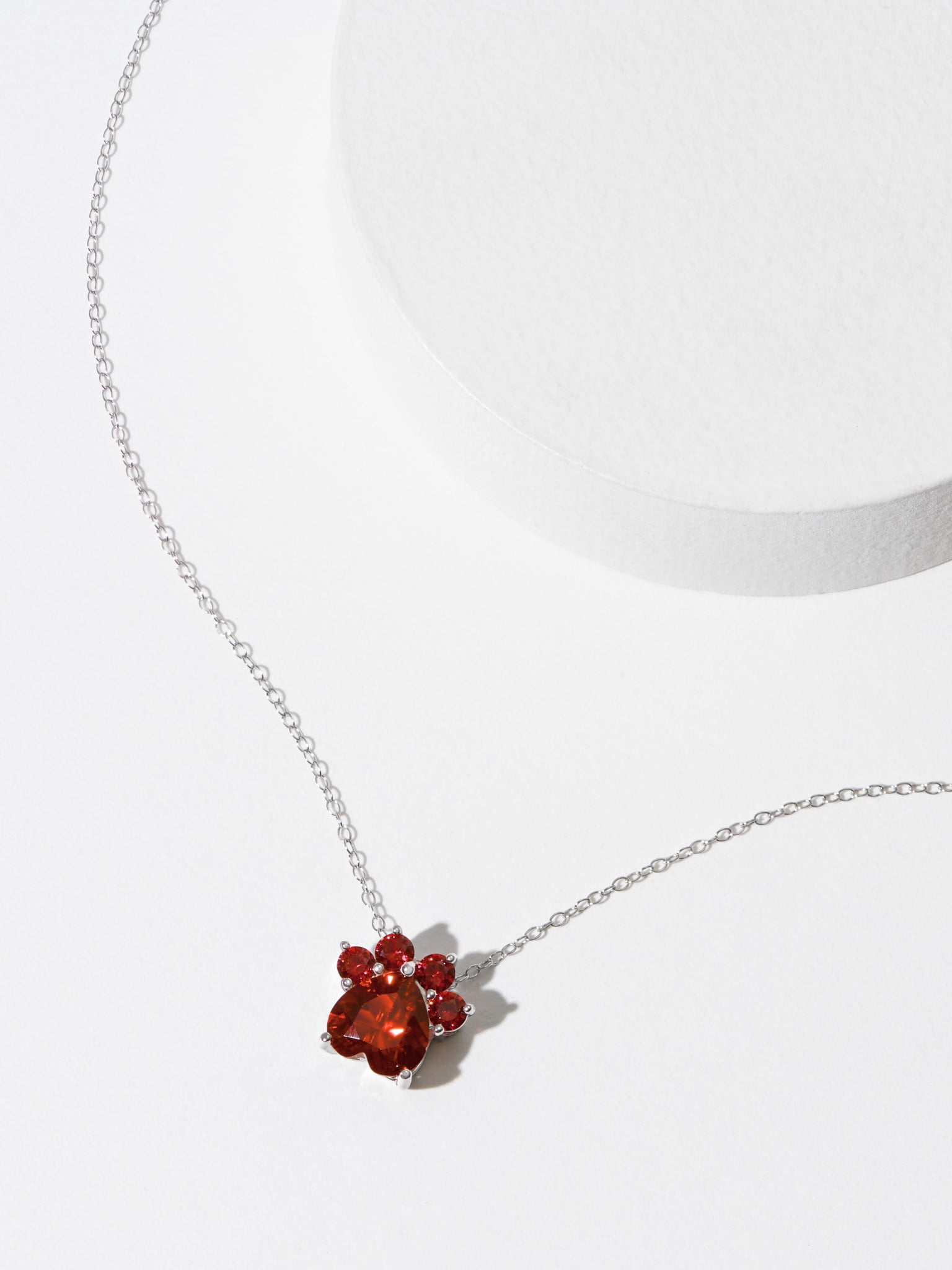 Forever Facets Jewelry Platinum over Sterling Silver Simulated Garnet Paw Print Necklace