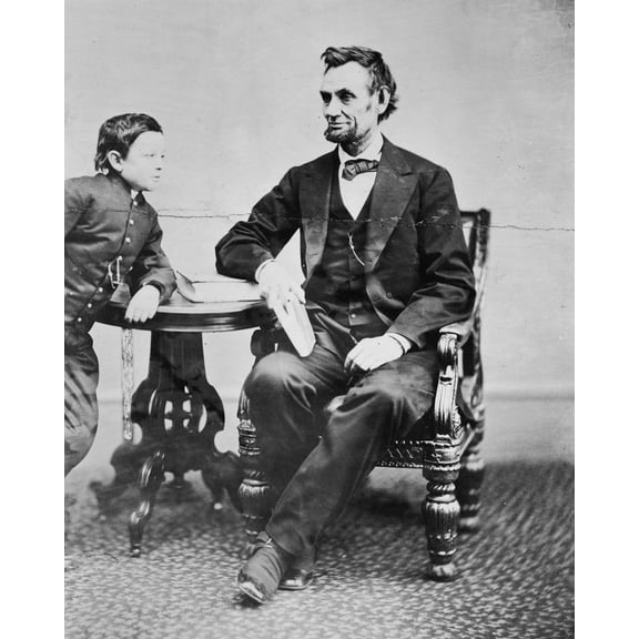 Print: Abraham Lincoln, With His Son Tad (Thomas) Leaning On A Table, 1865