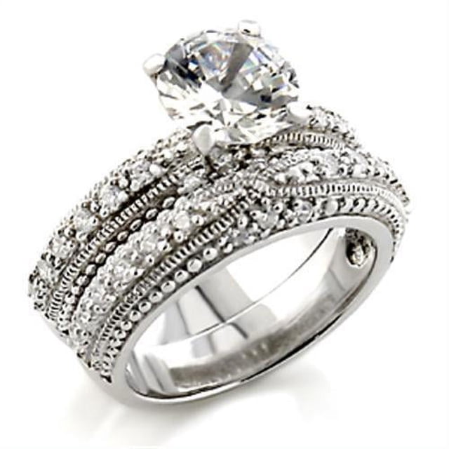 Bague en Laiton Rhodié avec Oxydes de Zirconium de Qualité AAA Transparents pour Femmes, Présentant une Coupe Taille 9 et un design Intemporel. la Bague Met en Valeur une Grande Pierre Cubique en Zirconium Transparent comme Pièce Maîtresse, Entourée de Détails Complexes et de Petites Pierres Étincelantes Serties dans un Anneau en Laiton Rhodié. Idéale pour Ajouter de l'Élégance à Toute Tenue Ou occasion.