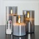 thumbnail image 1 of Velas parpadeantes sin llama de vidrio gris plateado con control remoto, paquete de 3 velas falsas LED realistas. 3" de alto 4" 5" 6", 1 of 5