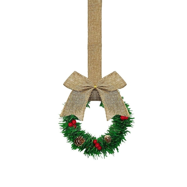 Décor de Noël "Couronne de Cabinet de Noël : une Décoration Festive de Cuisine avec des Rubans, des Nœuds, des Pommes de Pin et des Baies Rouges" Décorations de Noël