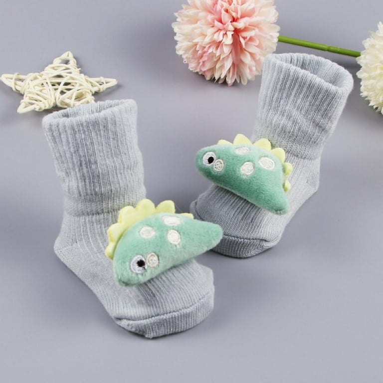 Baby girl deals socks with grip