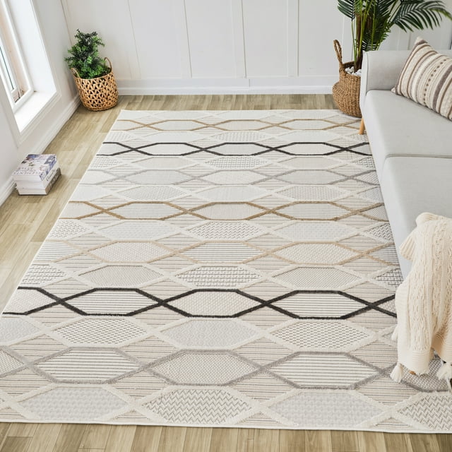 Cream beige geometric indoor area rug with diamond patterns placed on light wood floor next to gray sofa and woven baskets in modern living room.