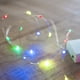 thumbnail image 1 of Cadena de luces a pilas con 20 micro LED multicolores sobre cable plateado, 1 of 4