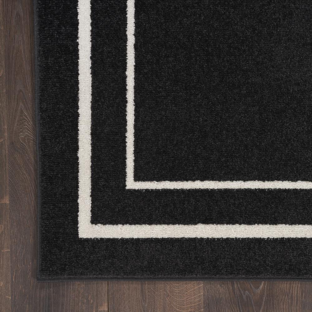 Nourison Essentials Indoor/Outdoor Black Ivory 5' x 7' Area Rug, (5x7)