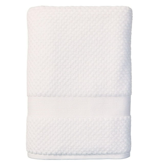 Soft white towel from Better Homes & Gardens Signature collection featuring a popcorn texture and decorative smooth band.