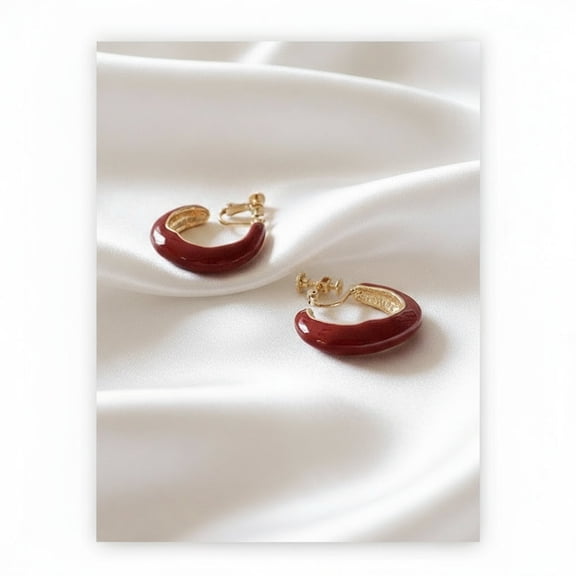 Clip on 1 1/4" gold and burgundy wavy open back hoop earrings