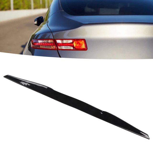 KIMISS 99cm Car Spoiler, a universal rear trunk spoiler made of durable rubber, measuring approximately 99 x 6cm (39 x 2.4in). The spoiler features a glossy black finish and is designed to enhance vehicle aerodynamics by reducing wind resistance and improving driving stability. Suitable for most cars, it adds a sporty and stylish touch to the rear trunk. The image shows the spoiler in a close-up view, highlighting its sleek design, with a car's rear trunk in the background.