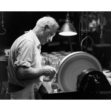 Glass engraver working on a grinding stone Canvas Art - (24 x 36)