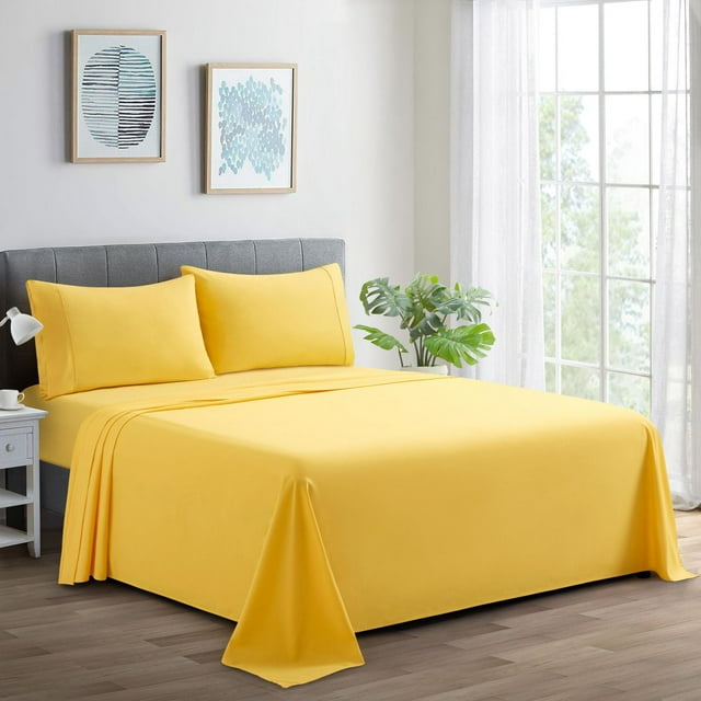 Marina Decoration 600 thread count yellow percale cotton sheet set on gray upholstered bed in bright bedroom with modern decor.