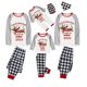 thumbnail image 1 of Pijamas familiares a juego de Navidad, conjunto de pijamas de Dachshund a través de la nieve, color blanco y negro, 2023, 1 of 3