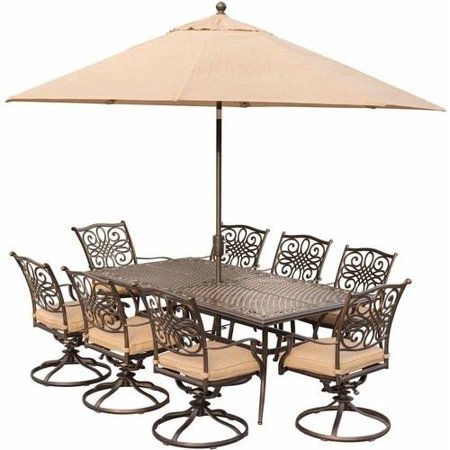 Hanover Outdoor Traditions 9-Piece Dining Set with 42" x 84" Cast-Top Table, 8 Swivel Rockers and Umbrella with Stand, Natural Oat