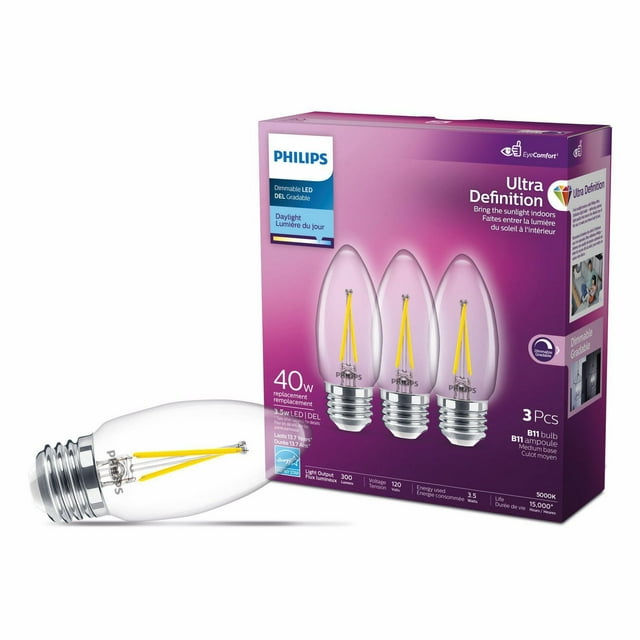 Philips UltraDefinition LED B11 E12 light bulb 40W equivalent, dimmable daylight (5000K), shown as a pack of three bulbs with one bulb outside the box.