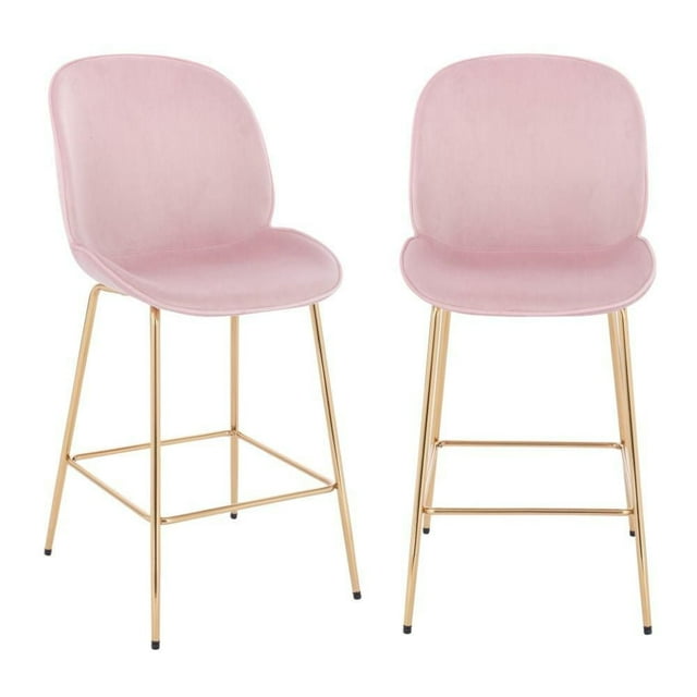 Set of two pink upholstered velvet stools with gold legs and footrests, designed for kitchens or bars.
