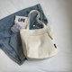 thumbnail image 1 of Bolso casual de color sólido de gran capacidad, versión coreana, primavera y verano 2025, nuevo estilo, bolso de recuperación para uso fuera de la escuela, bolso de mano para hombro y axila., 1 of 5