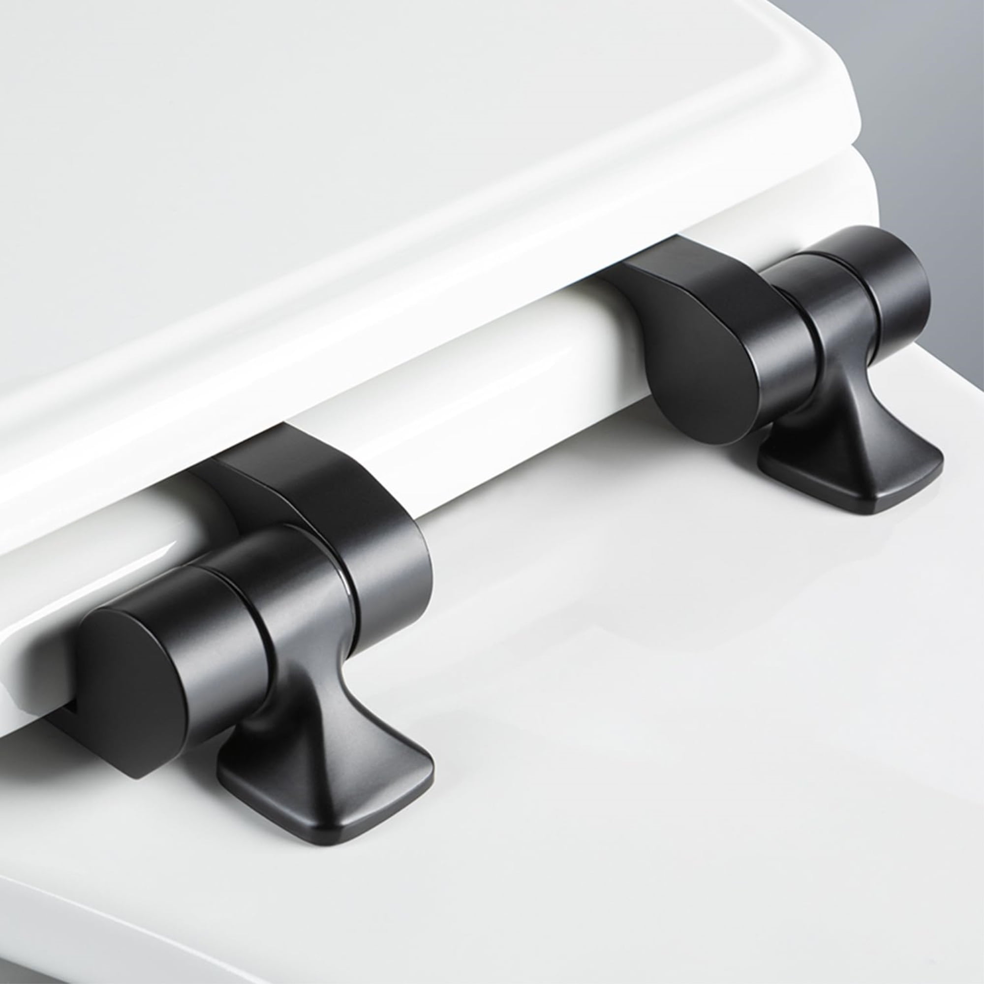 Mayfair BentonÂ®Elongated Enameled Wood Toilet Seat in White with Never Loosens and Soft Close Matte Black Hinge