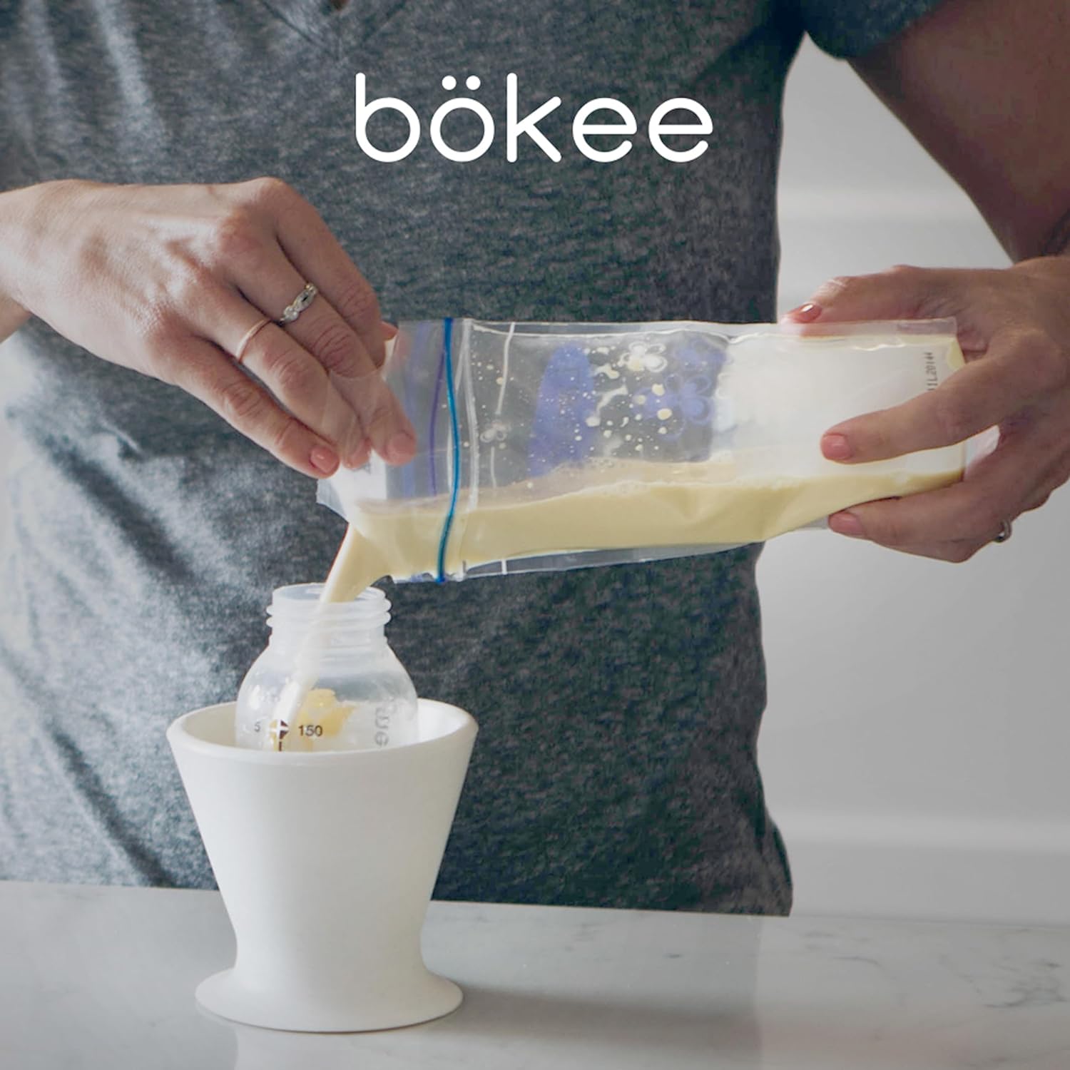 Bökee Baby Bottle and Breast Pump Holder and Snack Bowl – Silicone One Hand Milk & Formula Prep with Suction Cup - Dishwasher Safe - White, 1-Pack