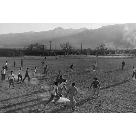 Players involved in a football game on a dusty field buildings and mountains in the distance  Ansel Easton Adams was an American photographer best known for his black-and-white photographs of the (Best Photos Of Football Players)