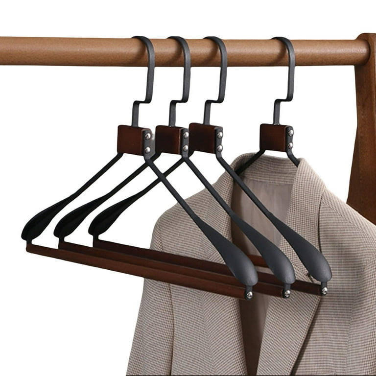 Black Wooden Hangers Hanging On Rack Rail Stock Photo, Picture and Royalty  Free Image. Image 32578781.