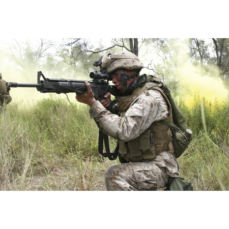 Townsville Australia March 15 2006 - Rifleman fires his M16A-4 Service Rifle during a live-fire assault and maneuver exercise during sustainment training in the Australia outback Poster