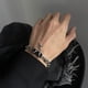 thumbnail image 1 of Pulsera de cuerda con forma de estrella de diamante negro para hombre, estilo simple, moderno y atractivo, de acero de titanio, joyería de mano de estilo permanente y simple, 1 of 5