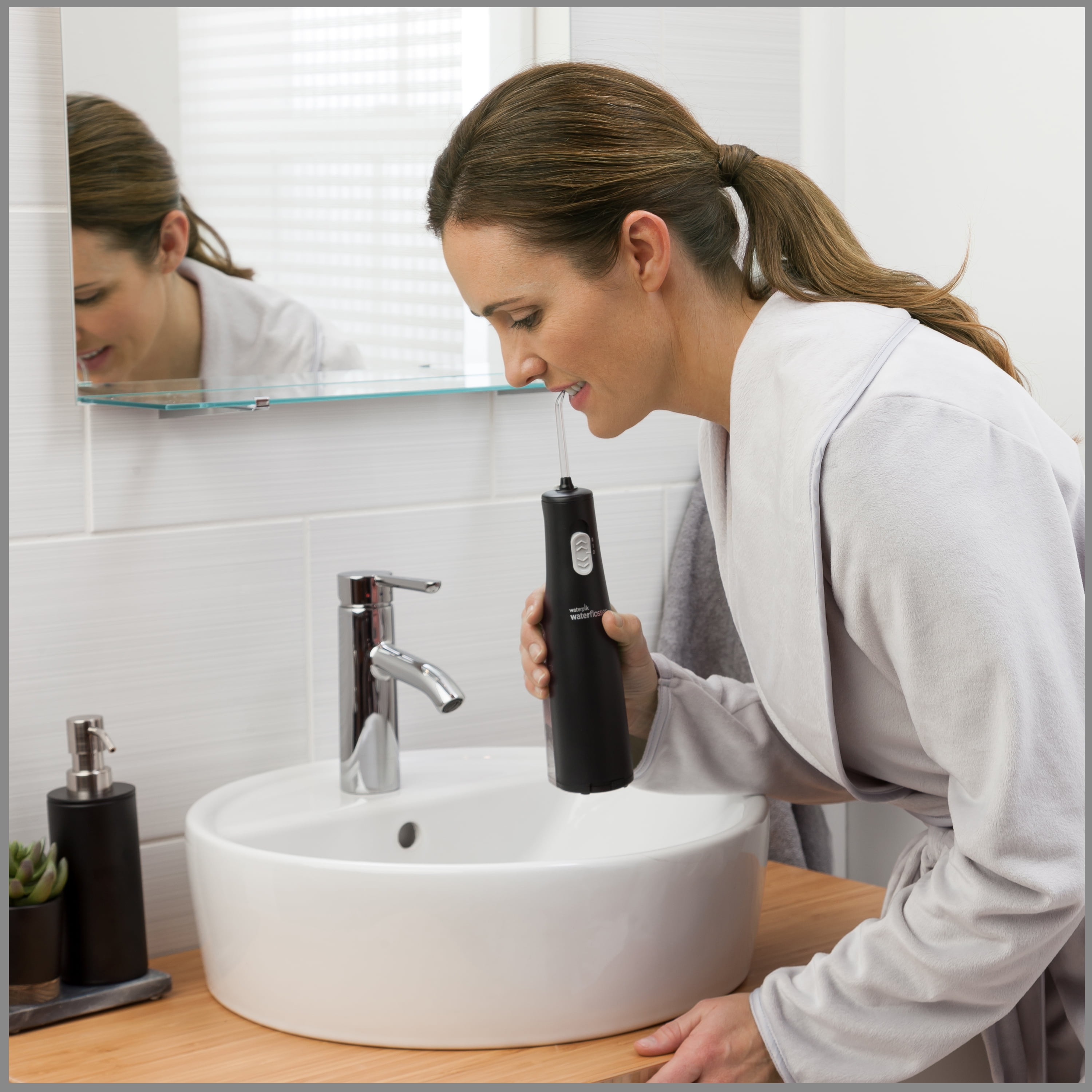 Waterpik Cordless Express Portable Water Flosser with 2 Settings, 2 Tips, ADA Accepted, Black (Packaging May Vary)