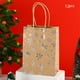 thumbnail image 1 of Bolsa de tela con diseño de copo de nieve navideño | Bolsa de regalo de papel kraft con base plana para fiestas | Empaque para regalos pequeños, dulces y presentes, 1 of 6