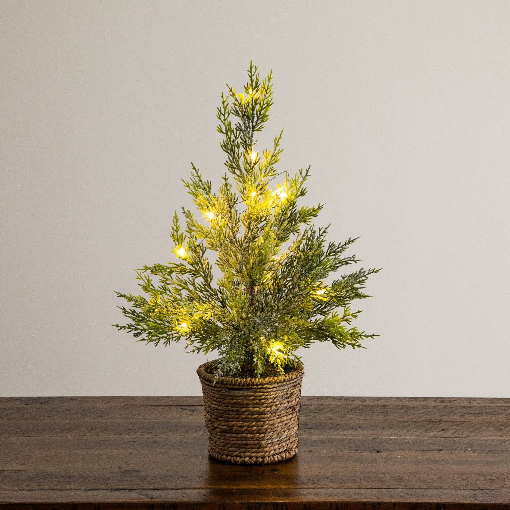18in. Pre-Lit Artificial Snowed Cypress Christmas Tree with 15 LED Lights in Hyacinth Basket