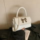 thumbnail image 1 of Bolso de mano con lazo, nuevo estilo primavera 2025, bolso bandolera con bandolera que combina con todo, elegante y pequeño bolso cuadrado., 1 of 4