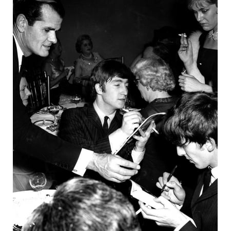 John Lennon and George Harrison signing autographs Photo