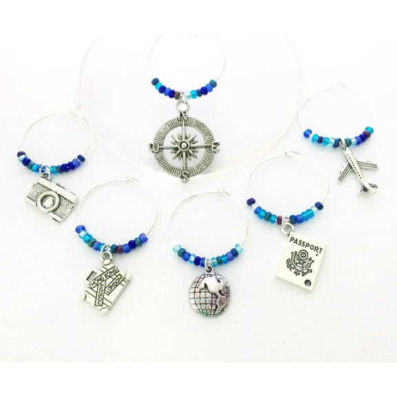 Travel themed Wine Charms: Charms include Camera, Compass, Suitcase, Globe, Passport, and an Airplane. Set of 6 Multi Blue Beaded Charms.