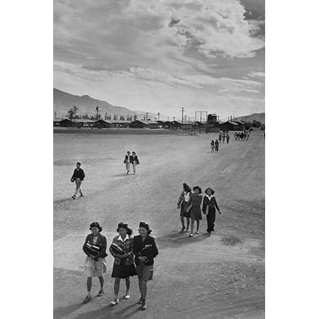 Teenagers walking along street most carrying books  Ansel Easton Adams was an American photographer best known for his black-and-white photographs of the American West  During part of his career he