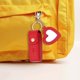 thumbnail image 5 of Llavero portátil para brillo de labios con mini pintalabios de cuero PU para viajar, pequeño y con colgante en forma de corazón y llavero, 5 of 5