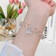 thumbnail image 2 of Pulsera de cristal de cuarzo transparente natural, elegante pulsera de cristal con dije de plata esterlina para mujer, diseño elástico ajustable, circunferencia de 7,1, 2 of 5