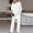 White, variant on Women's Elegant Solid Color 2 Piece Suit – Crew Neck Hollow-Out Mid Sleeve Asymmetrical Hem Top & Straight Leg Pants Navy Blue,M