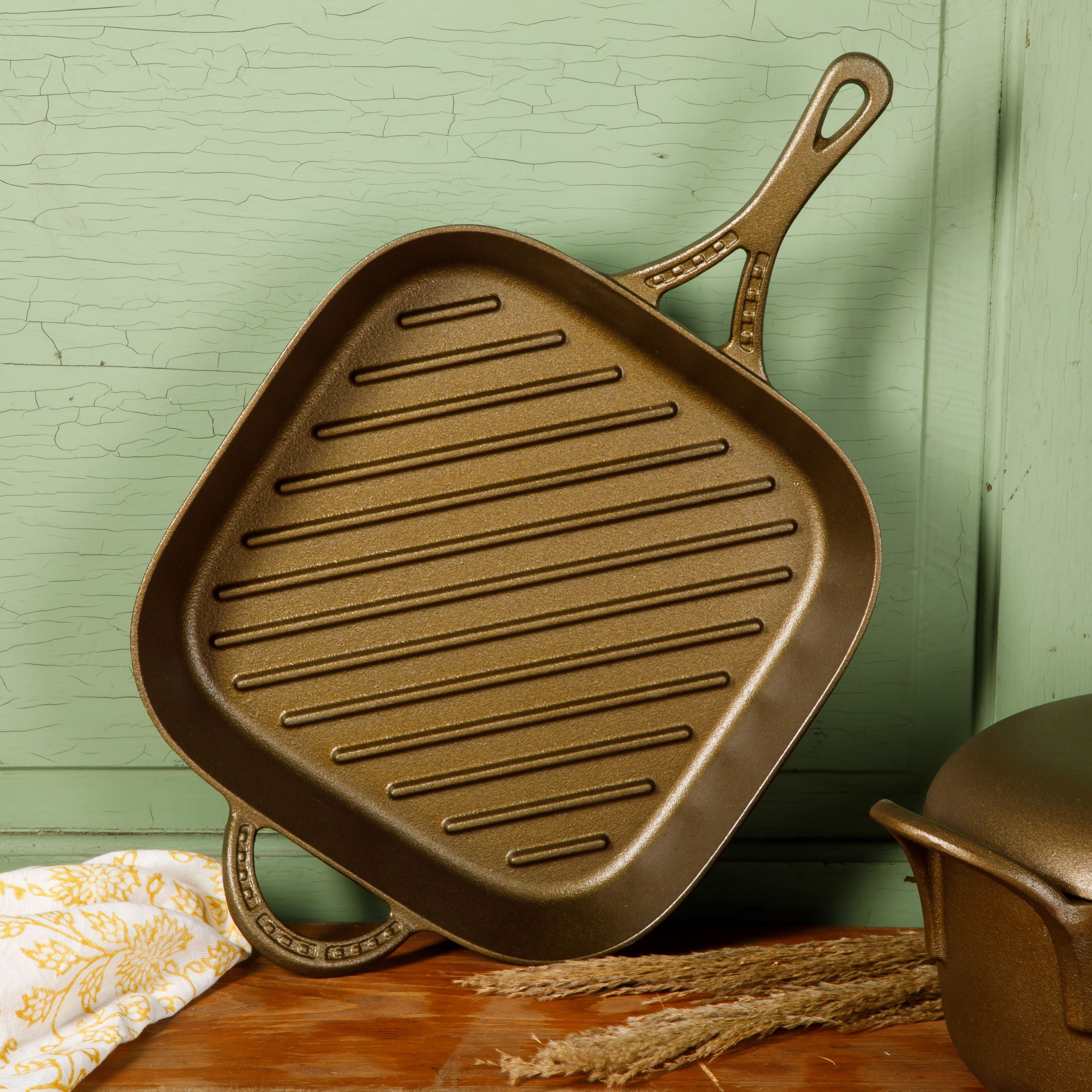 Brass grill pan placed on the gas stove 6929378 Stock Photo at