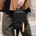 thumbnail image 4 of Bolsa pectoral impermeable multifuncional negra para hombre, mochila bandolera de gran capacidad de 31×18×9 cm con correa ajustable, puerto para auriculares y múltiples bolsillos para viajes, 4 of 5