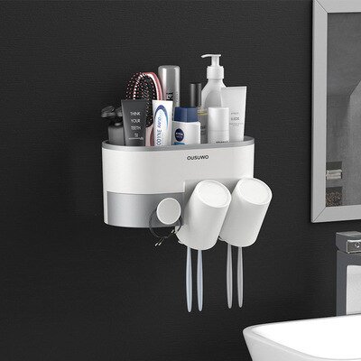 juego de accesorios de baño soporte magnético para cepillo de dientes con taza, dispensador de pasta de dientes, estante de almacenamiento de artículos de tocador, exprimidor de pasta de dientes: estante plástico ABS/PP blanco con base gris que se monta en pared sin perforar; contenedor superior para frascos, dispensador 11.3*7*6.1cm con boquilla hacia abajo, dos tazas magnéticas invertidas con drenaje y ranuras para cepillos; a menudo usado como organizador compacto para artículos de aseo.