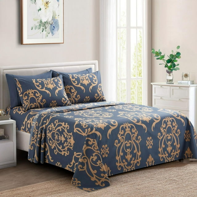 Ultra soft silky deep pocket sheet set with gold damask print on navy blue rayon from bamboo fabric, styled in a bright bedroom.