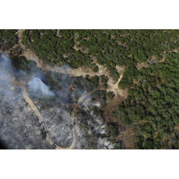 A wildfire burns land near Austin Texas Canvas Art - Stocktrek Images (34 x 23)