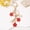 Red, variant on Japanese-style handmade cherry blossom keychain with oil-drop design, perfect for handbags.
