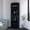 Black, variant on Vertical bar cabinet with 5+ shelves in light brown color for entertainment room optimizes storage
