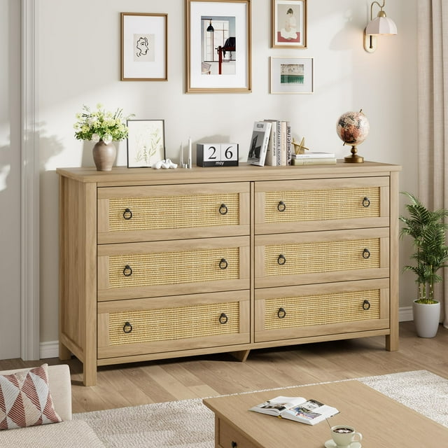 AKDSteel Rattan 6 Dresser for Bedroom, a 47.2-inch wide wooden storage dresser with six deep drawers. Boho-inspired rattan inlays and ring pull handles enhance its modern aesthetic, while the raised base allows for easy cleaning. Ideal for organizing clothes, accessories, or nursery essentials, shown in a stylish bedroom with decor accents like framed artwork, a globe, and a vase of flowers.